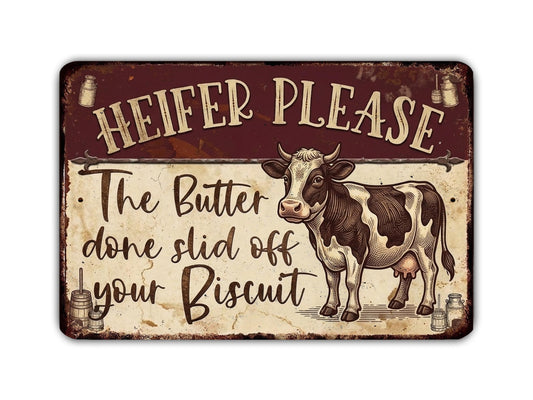 a sign with a cow and the text "HEIFER PLEASE" and "The Butter done slide off your Biscuit".