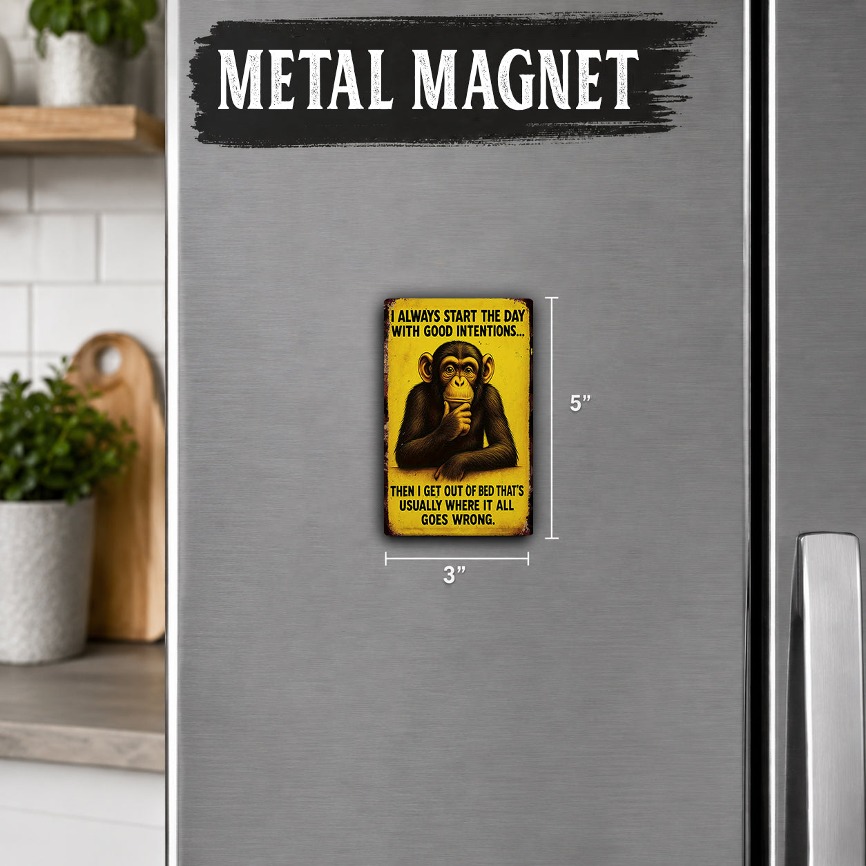 a small yellow and black magnet with a monkey on it, placed on a refrigerator.