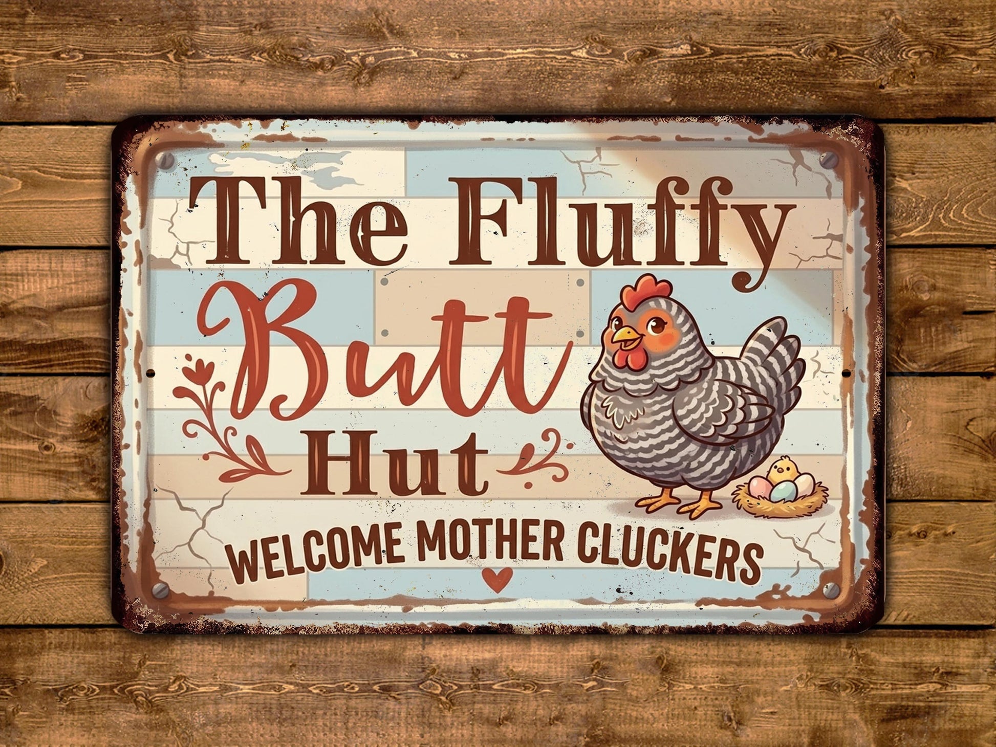 a sign with a cartoon chicken and the text "The Fluffy Butt Hut" and "Welcome Mother Cluckers" written on it.