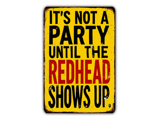 a sign with the text "It's not a party until the redhead shows up."