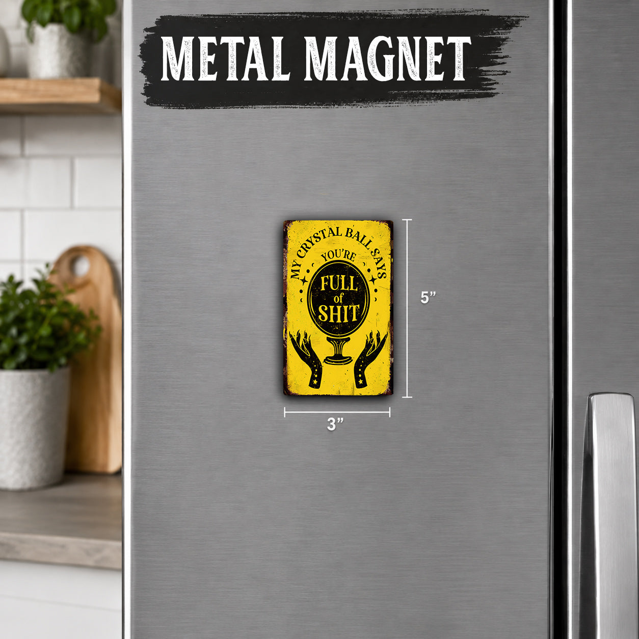 a small, yellow and black magnet with the text "MY CRYSTAL BALL SAYS FULL OF SHIT" on it, placed on a refrigerator.