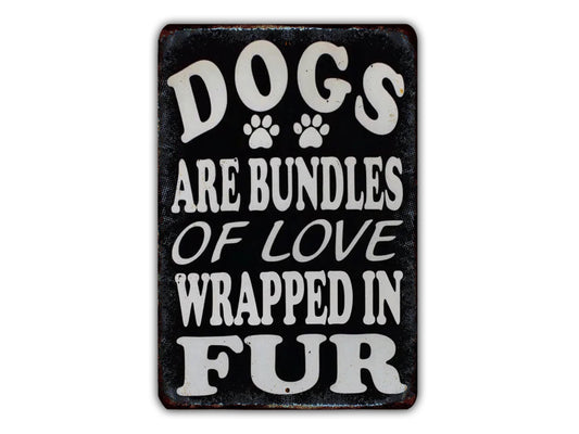 a sign with the text "Dogs are bundles of love wrapped in fur" in white letters.