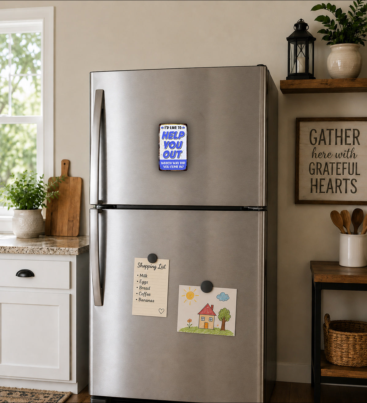 A stainless steel refrigerator with a "Help You Out" magnet on the door, a shopping list magnet, and a drawing of a house on the door. The refrigerator is situated in a kitchen with a window, plants, and a wooden shelf.
