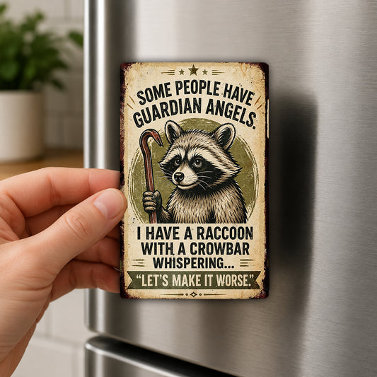 A person's hand is holding a metal refrigerator magnet with a raccoon illustration and text.