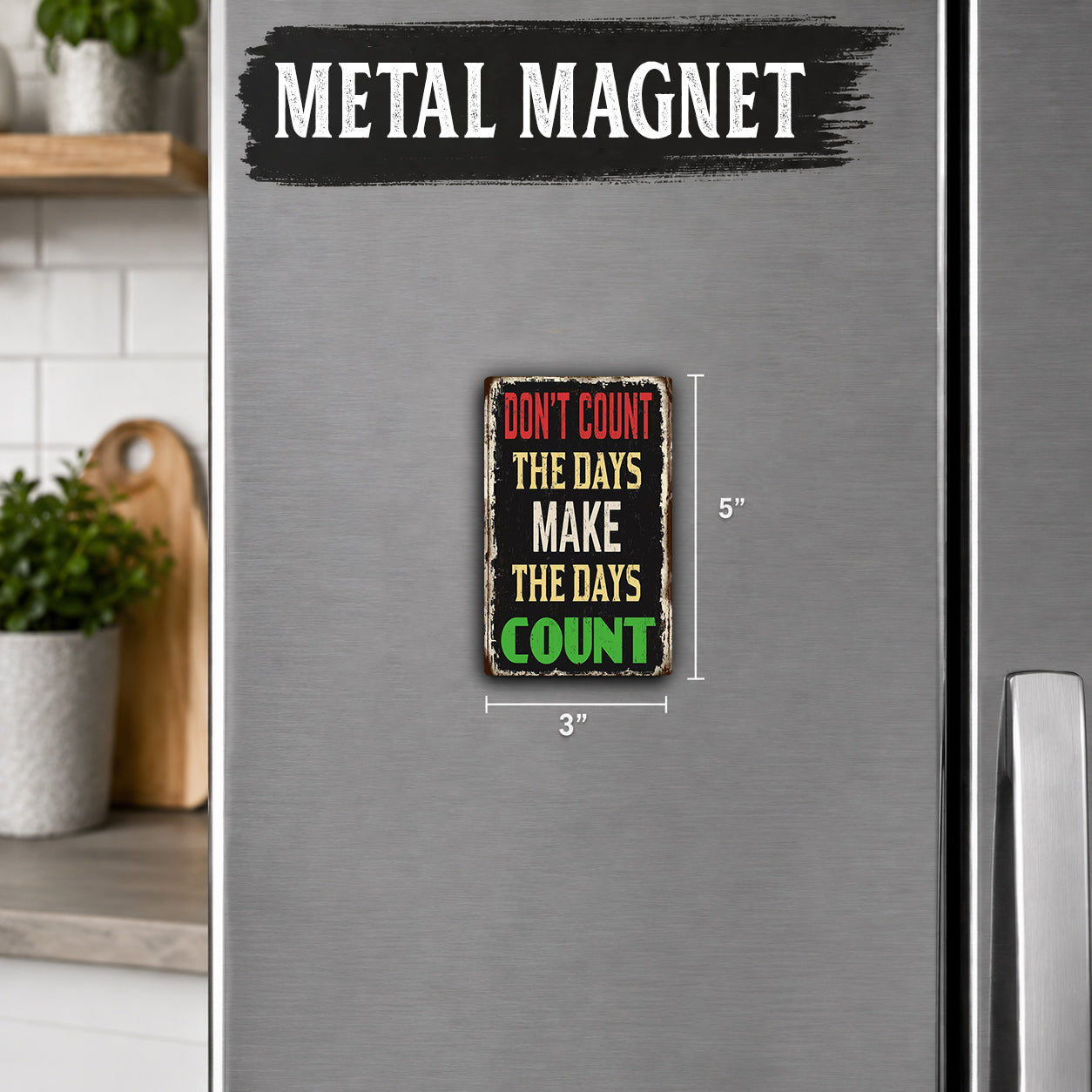 a small metal magnet with the text "Don't count the days make the days count" on it.