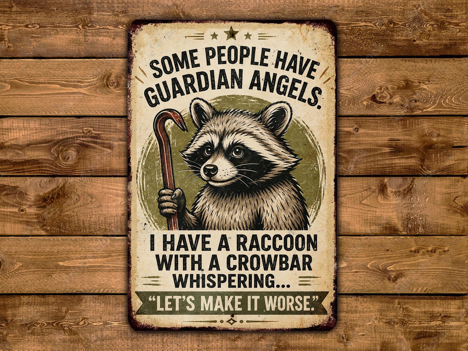 a raccoon holding a crowbar and a sign that says "Some people have guardian angels. I have a raccoon with a crowbar whispering. Let's make it worse."