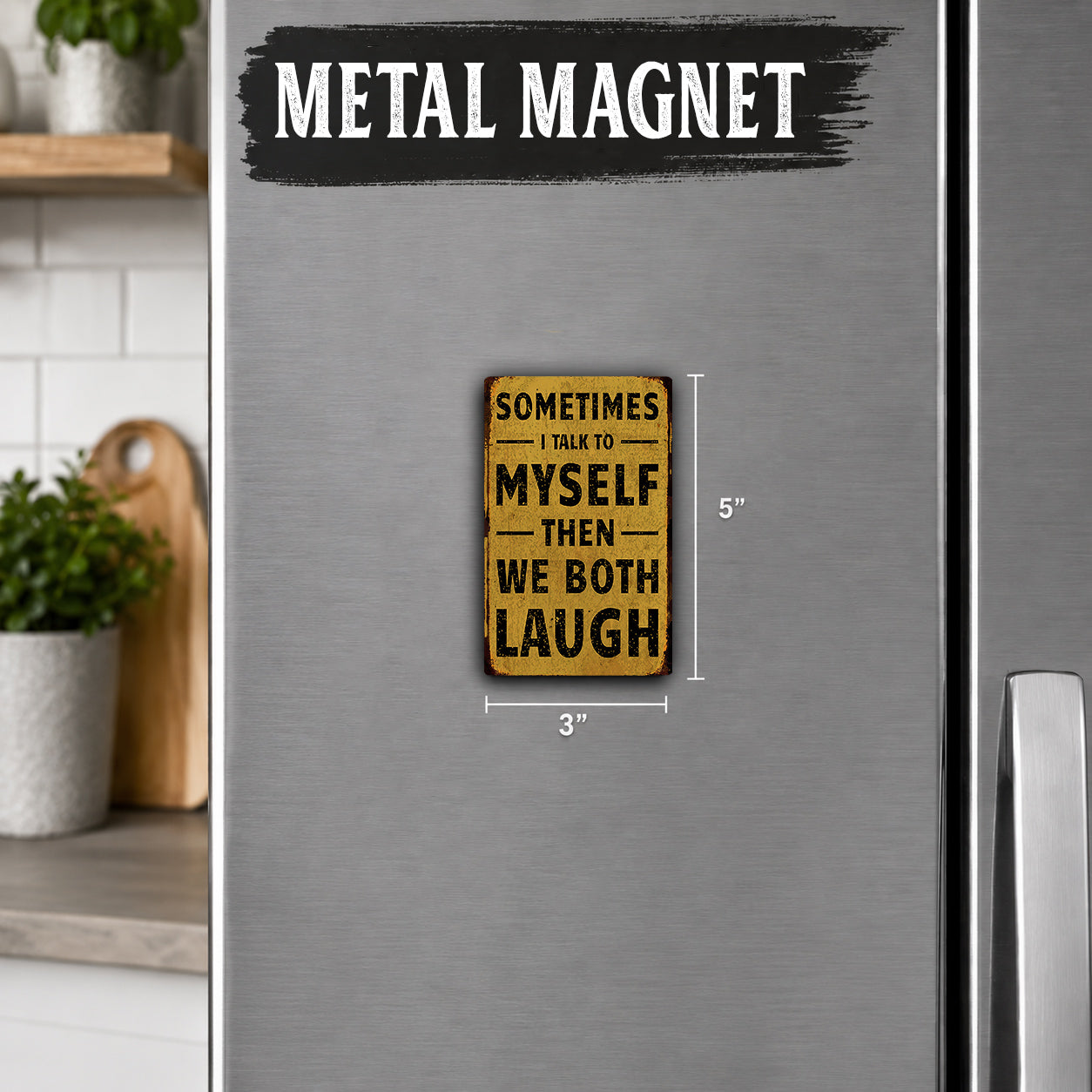 a small, vintage-style metal magnet with the text "Sometimes I talk to myself, then I both laugh" on it. The magnet is placed on a refrigerator, and there is a wooden cutting board visible in the background.