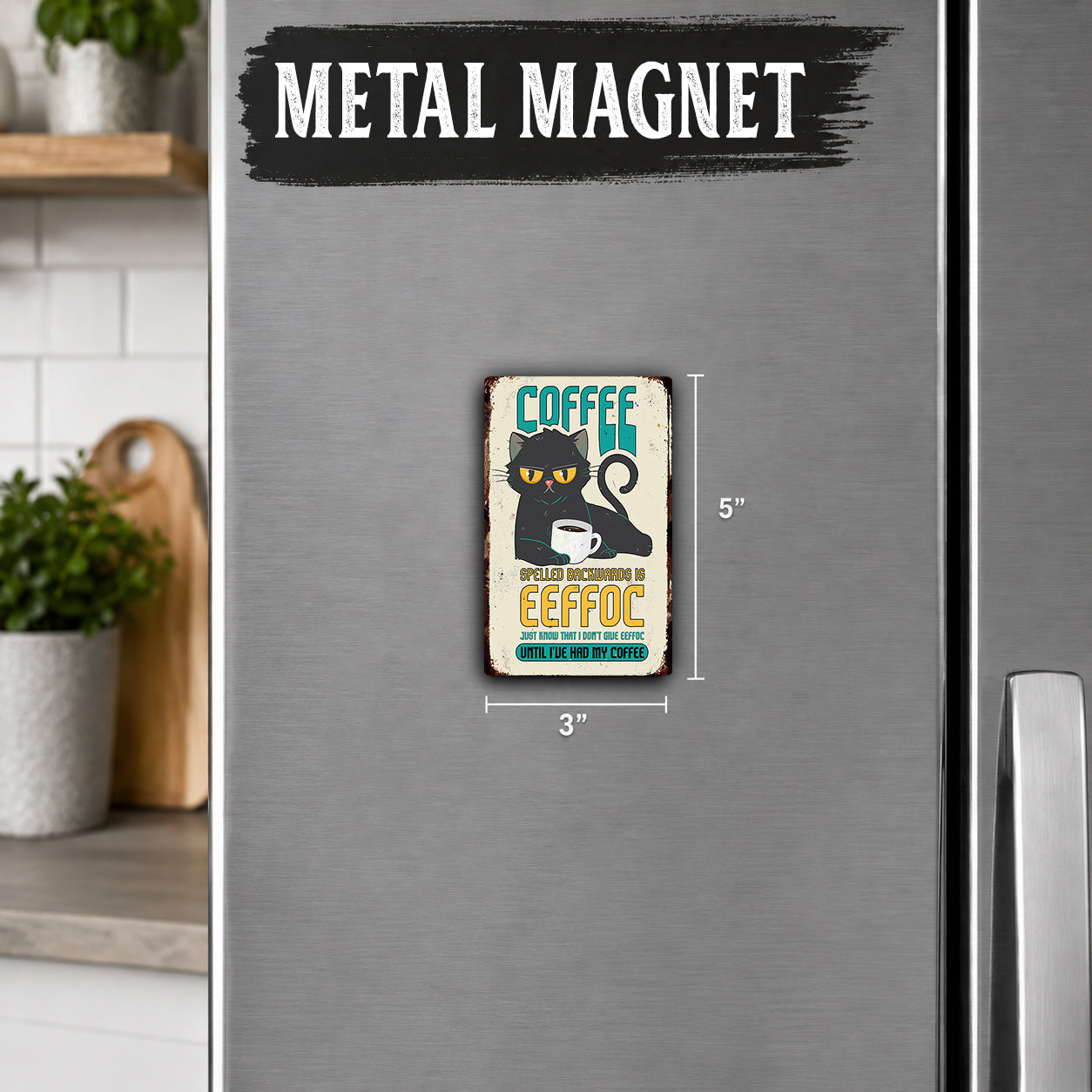 a small, vintage-style metal magnet with a cat illustration and text, placed on a refrigerator.