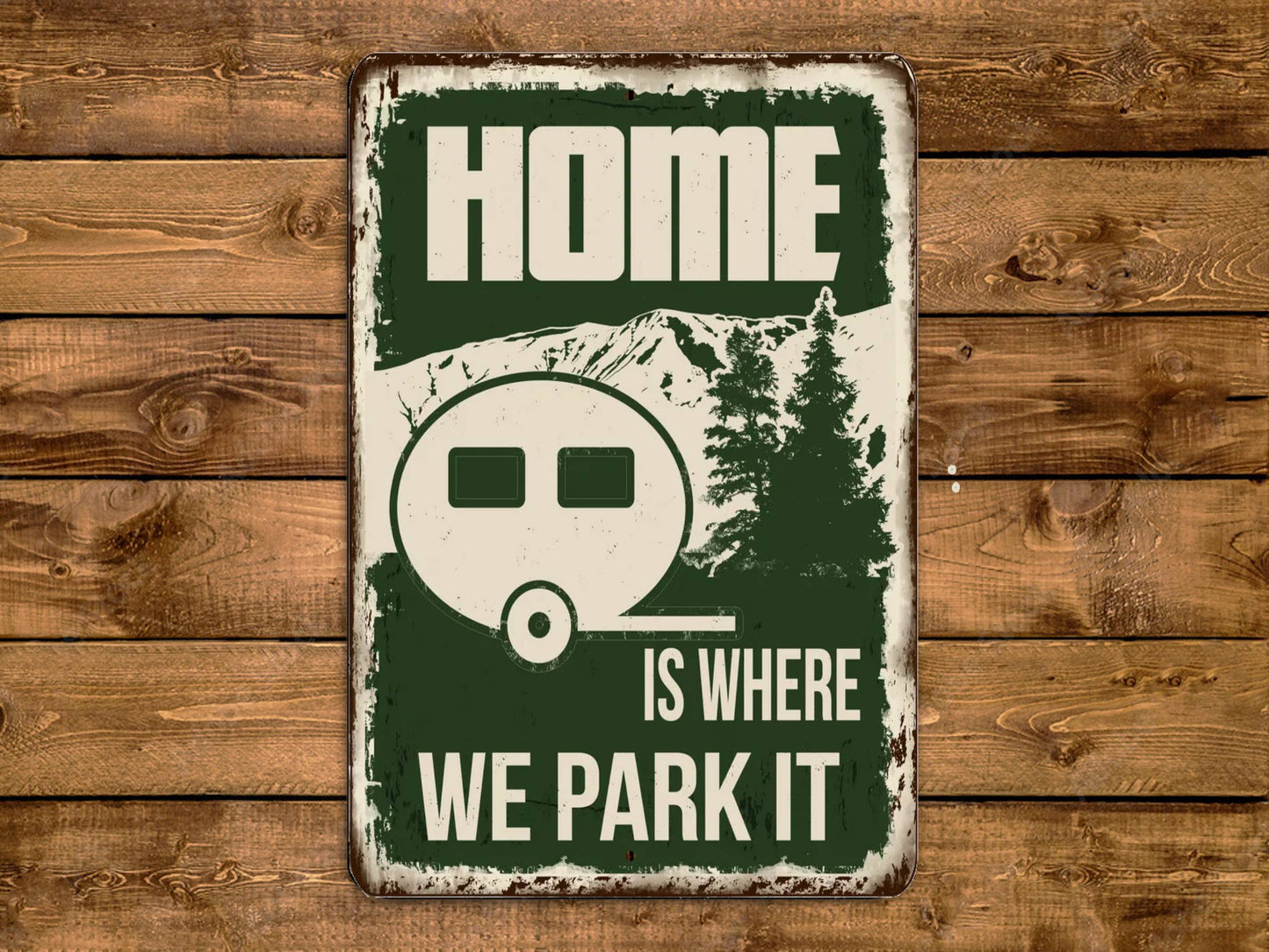 a metal sign that says home is where we park it