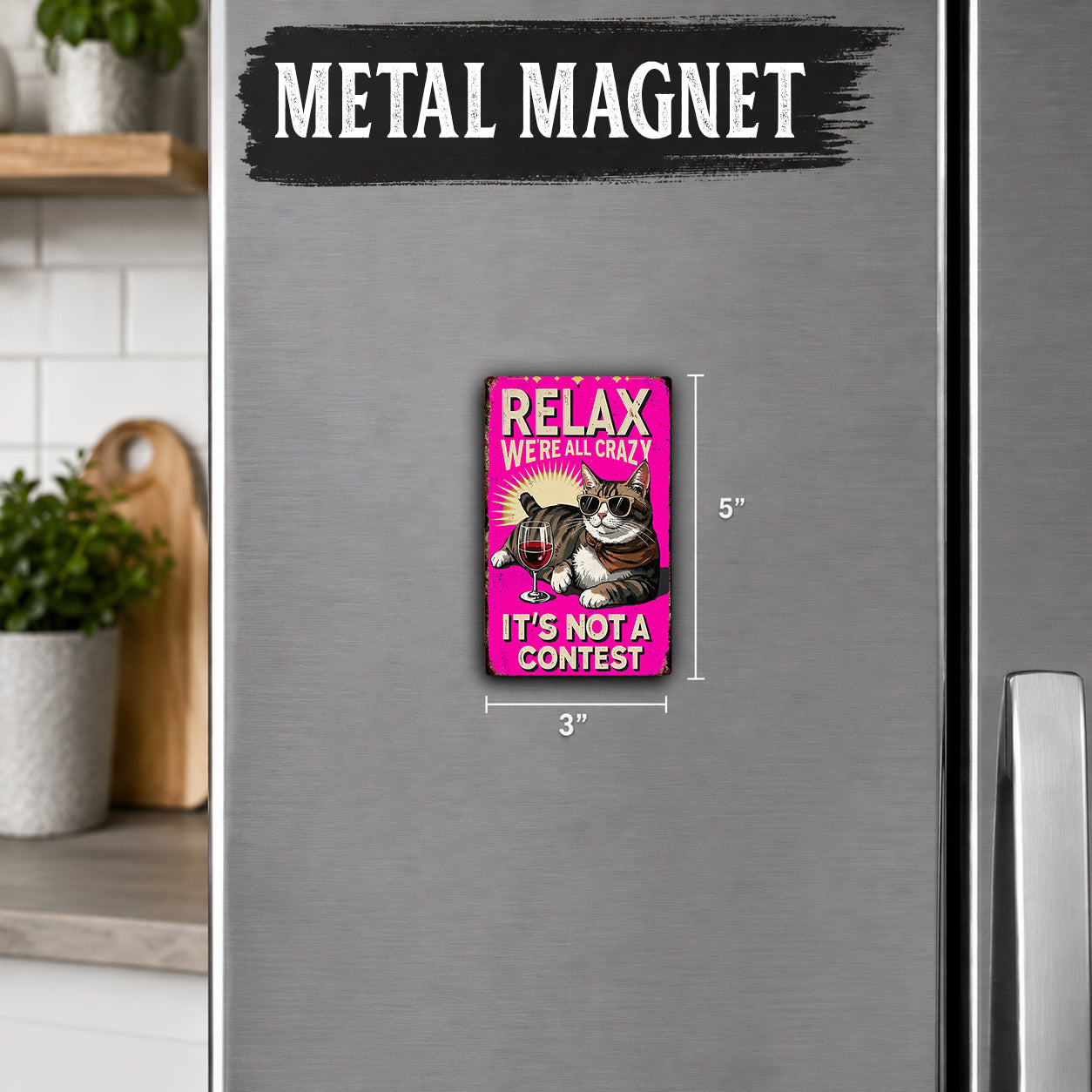 a pink magnet with a cat and the text "Relax, we're crazy, it's not a contest" on it.