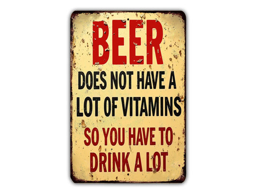 a sign with the text "BEER DOES NOT HAVE A LITTLE VITAMIN" in bold red letters.