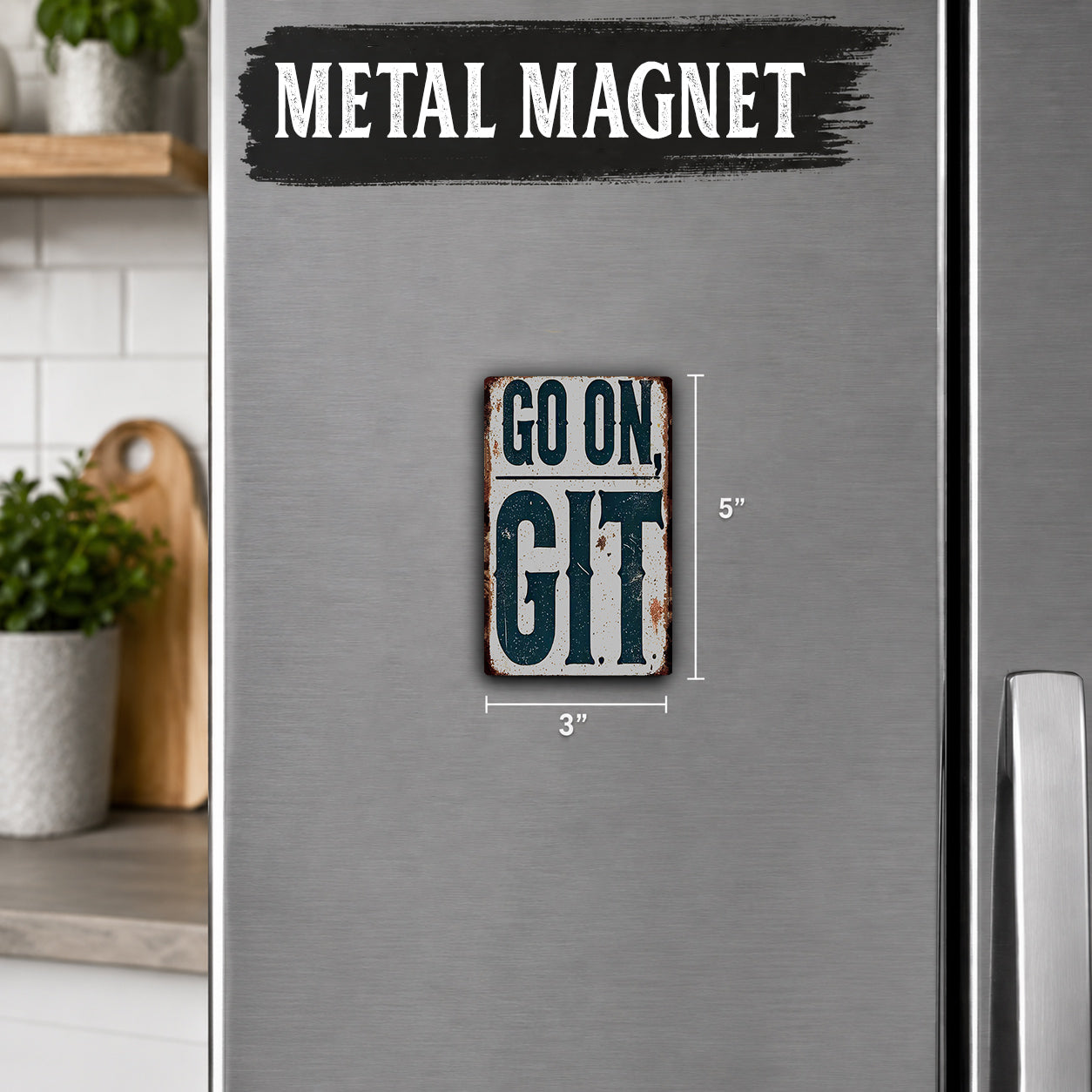 a small, vintage-style metal magnet with the text "GO ON GIT" on it. The magnet is placed on a refrigerator, which is part of a kitchen setting.
