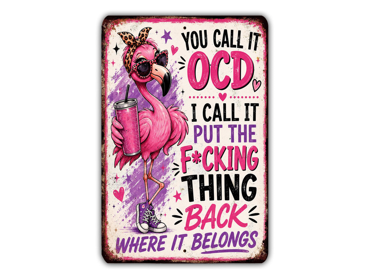 a pink flamingo holding a drink and wearing sunglasses, with text surrounding it that reads "You call it OCD, I call it put the F*CKING thing back where it belongs".