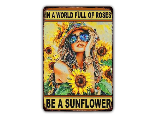 A woman wearing sunglasses and surrounded by sunflowers, with the text "In a world full of roses, be a sunflower" displayed above and below the image.