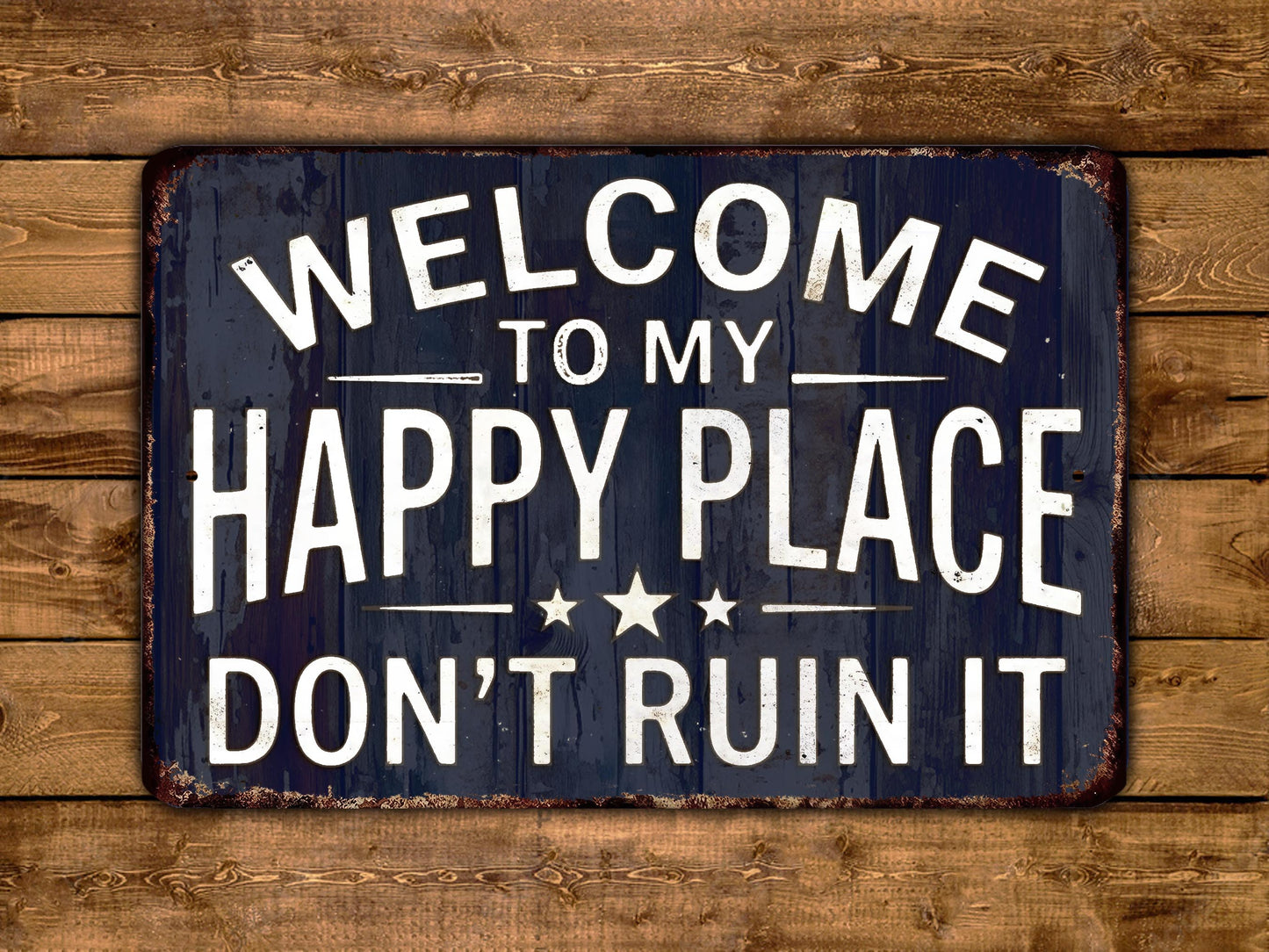 a sign with the text "Welcome to my happy place don't ruin it" in white letters against a dark background.