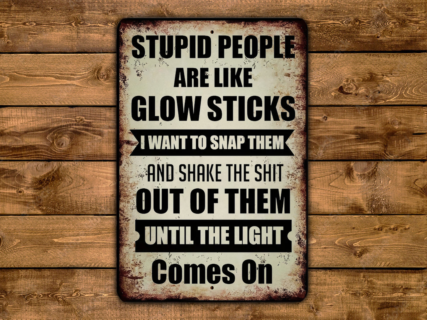 a sign that says stupid people are like glow sticks i want to snap them and