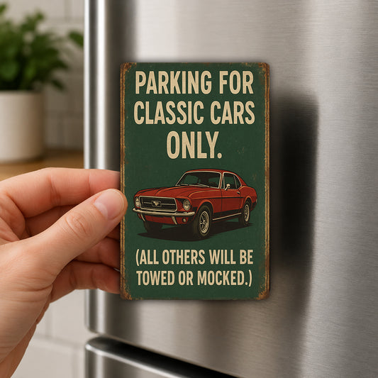 A person's hand is holding a vintage-style metal sign that reads "PARKING FOR CLASSIC CAR ONLY. (ALL OTHERS WILL BE TOWED OR MOCKED)."