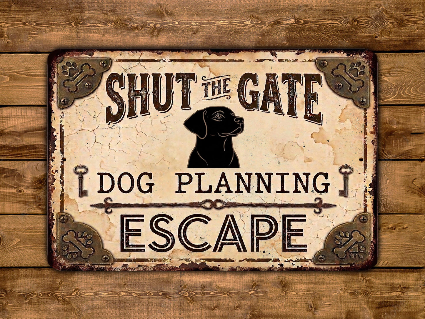 a sign with the text " Shut the Gate Dog Planning Escape" and a black silhouette of a dog.