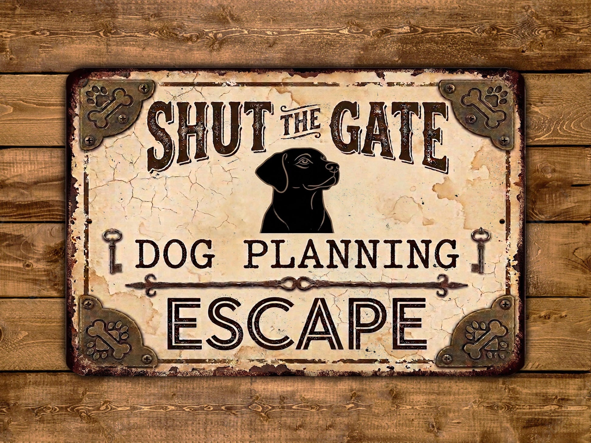 a sign with the text " Shut the Gate Dog Planning Escape" and a black silhouette of a dog.