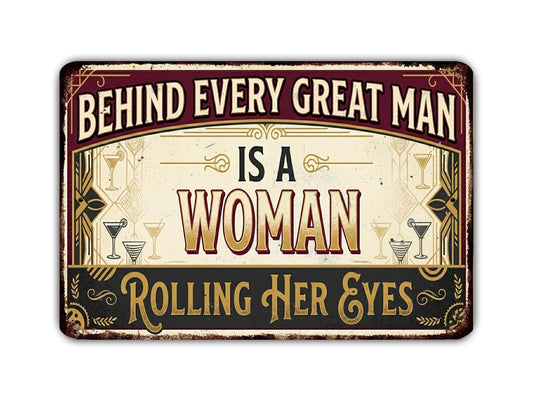 a sign with the text "Behind Every Great Man Is A Woman Rolling Her Eyes" in a vintage style.