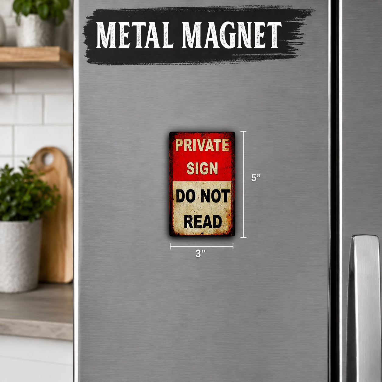 a metallic refrigerator with a small, vintage-style metal sign attached to it. The sign reads "PRIVATE SIGN DO NOT READ".