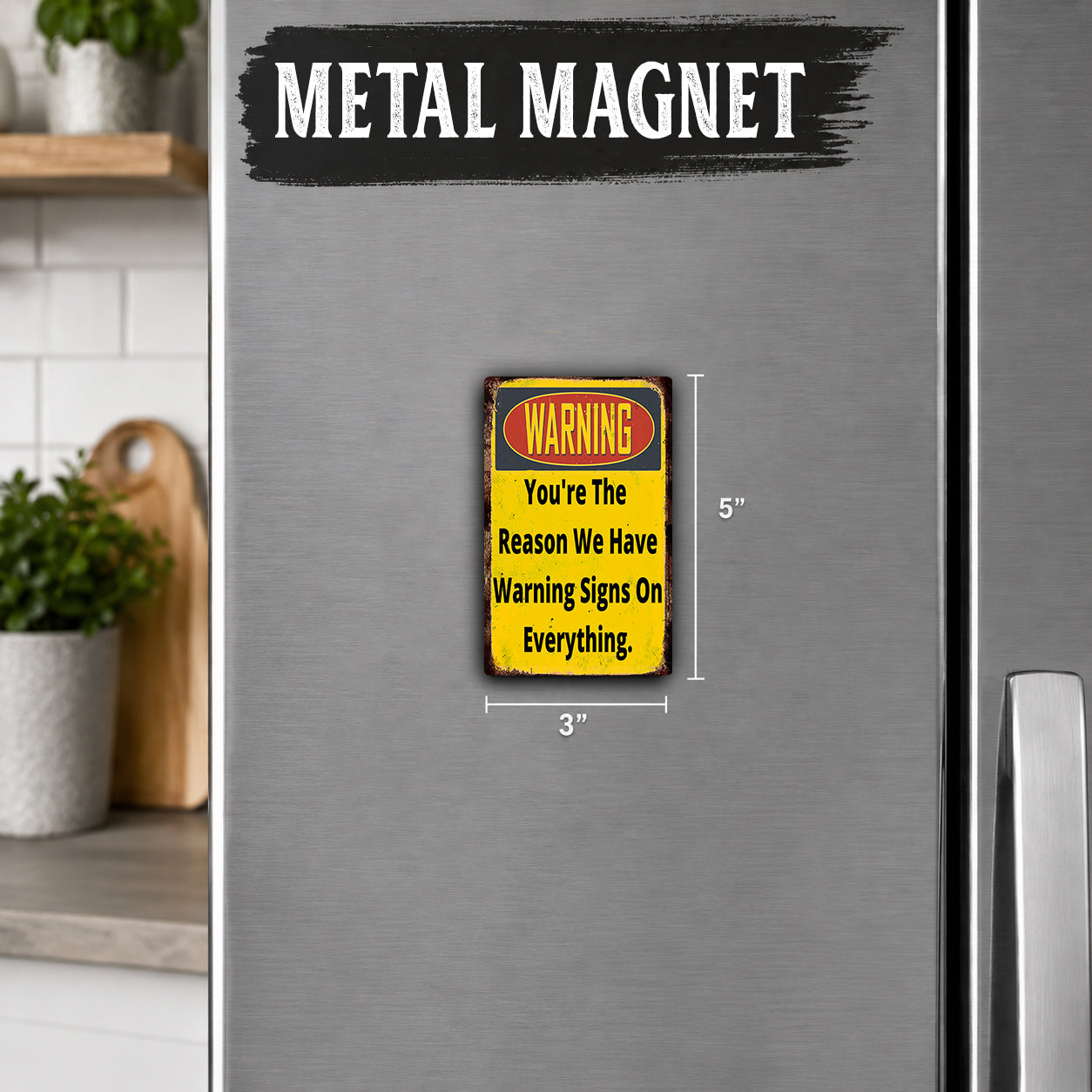a small, vintage-style metal magnet with a warning message on it.