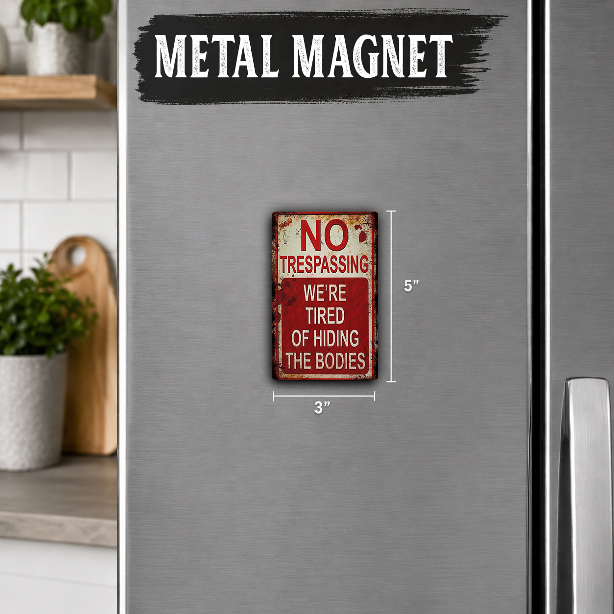 a small, red and white metal sign on a refrigerator door that reads "NO TRESPASSING WE'RE TIRED OF HIDING THE BODIES".