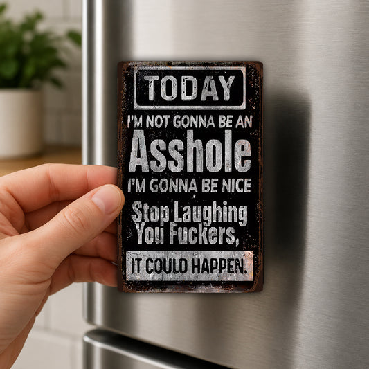 A person's hand holding a metal sign with a humorous message on it.