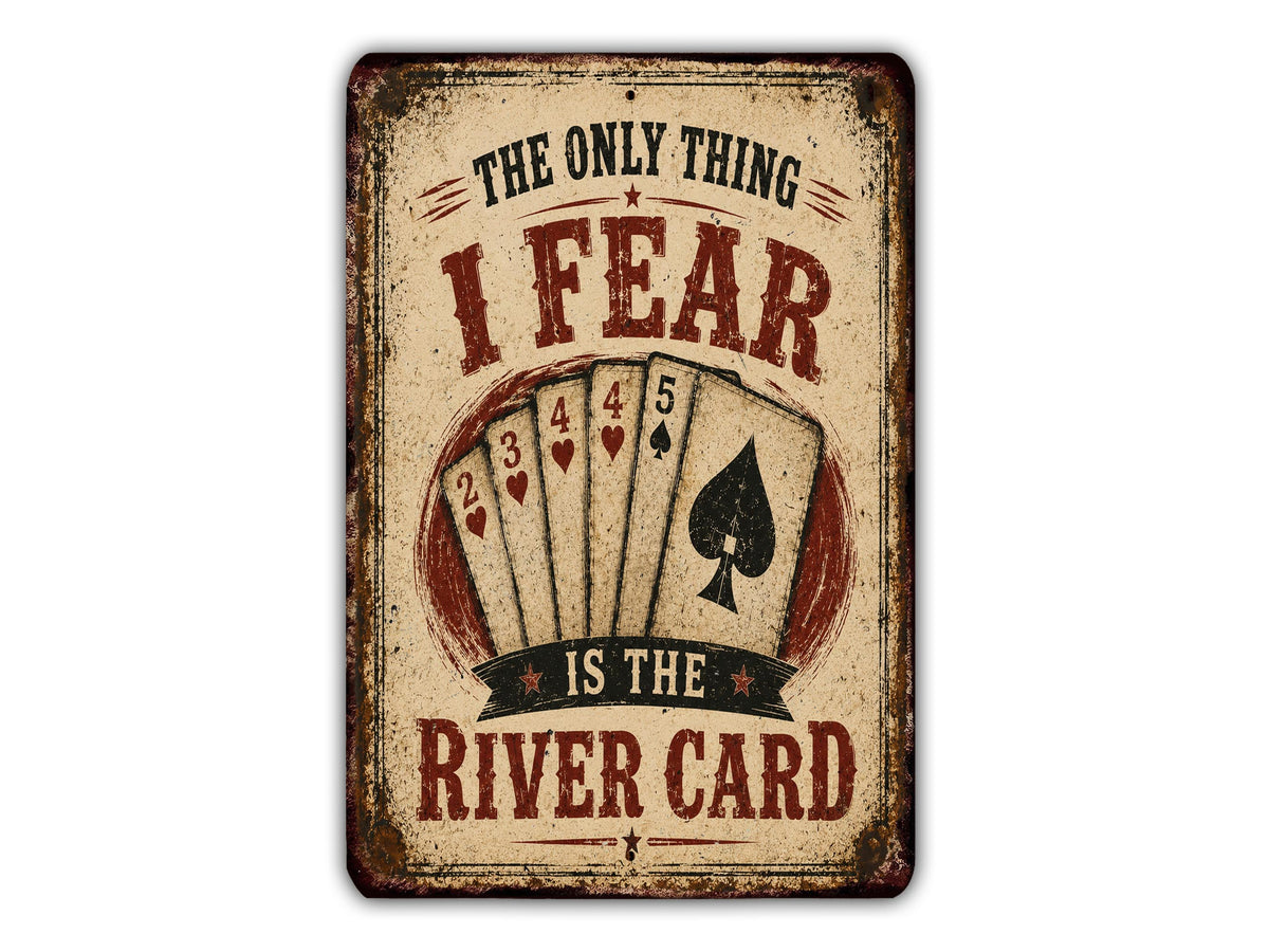 a vintage-style sign with the text "The only thing I fear is the river card" and a graphic of playing cards.