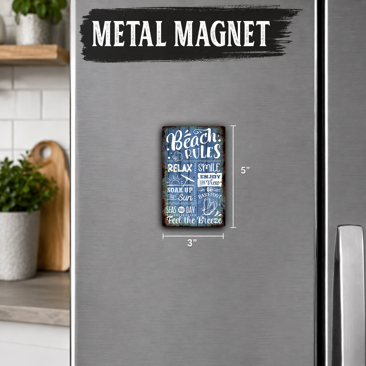 a metal refrigerator with a metal magnet on it that contains text and a beach-themed design.