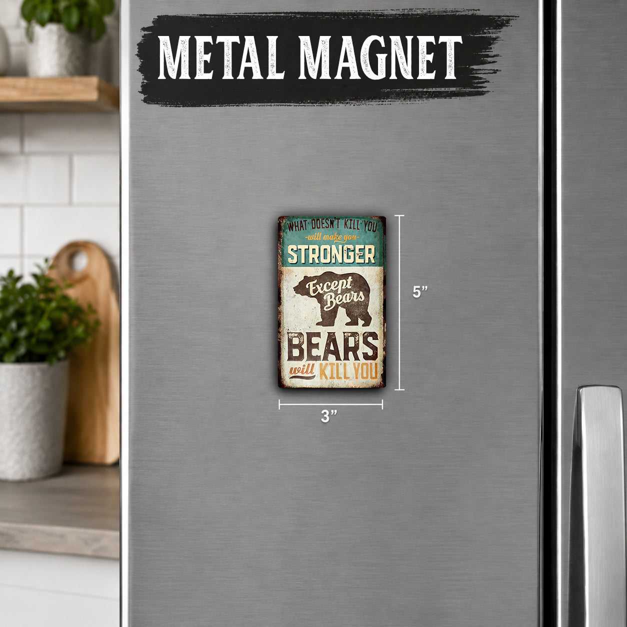 a metal refrigerator with a small metal magnet on it. The magnet has a humorous message about bears and their strength.