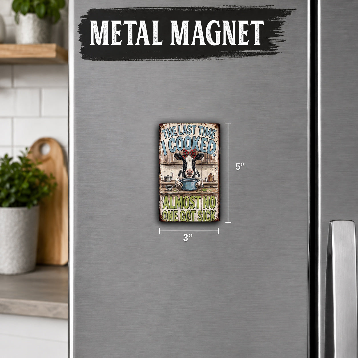 a small metal magnet with a humorous message on it, placed on a refrigerator.
