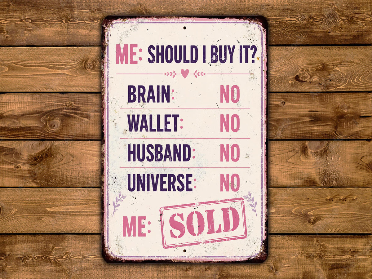 The image is a humorous sign with a list of items and a "Me: Sold" stamp, placed on a wooden background.