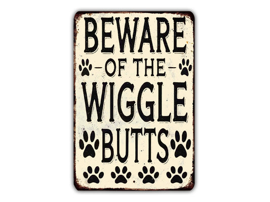 a sign with the text "BEWARE OF THE WIGGLES BUTTS" and paw prints.