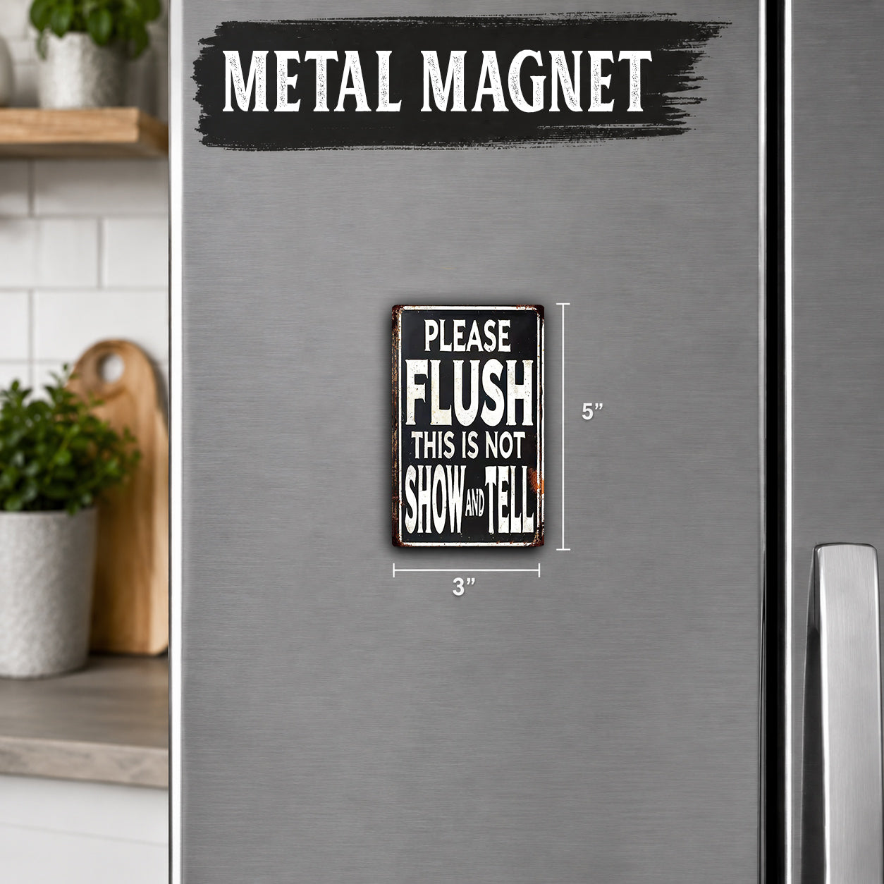 a metallic refrigerator with a small sign attached to it. The sign reads "PLEASE FLUSH THIS IS NOT SHOW AND TELL", indicating that the refrigerator is not to be used for displaying or hiding information.