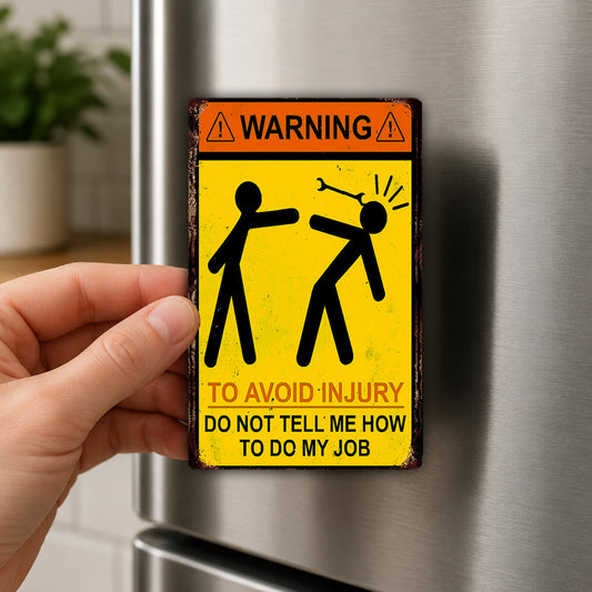 A person is holding a metal sign with a warning message on it.