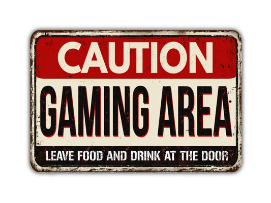 a sign that says caution gaming area leave food and drink at the door