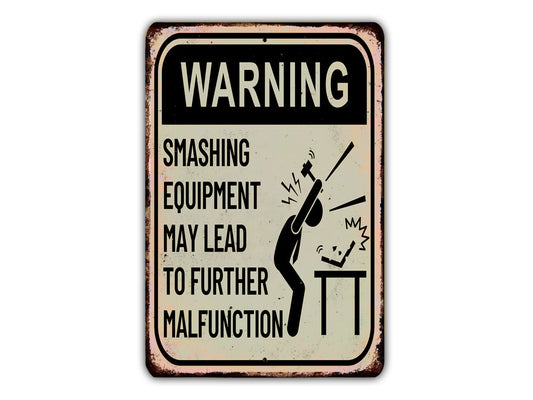 a warning sign warning of smashing equipment may lead to further malfunction