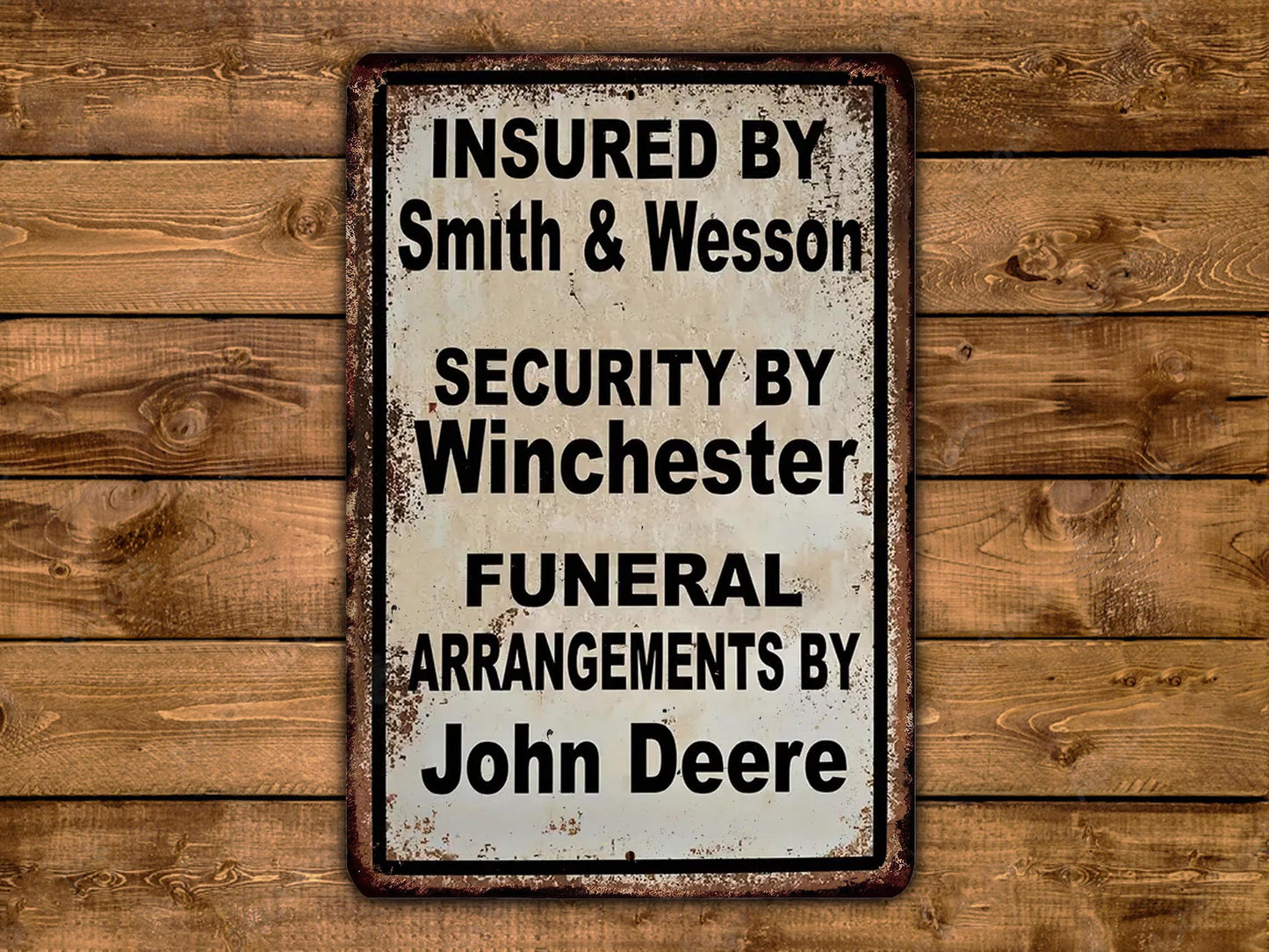 a sign that reads "Insured by Smith & Wesson Security by Winchester Funeral Arrangements by John Deere".
