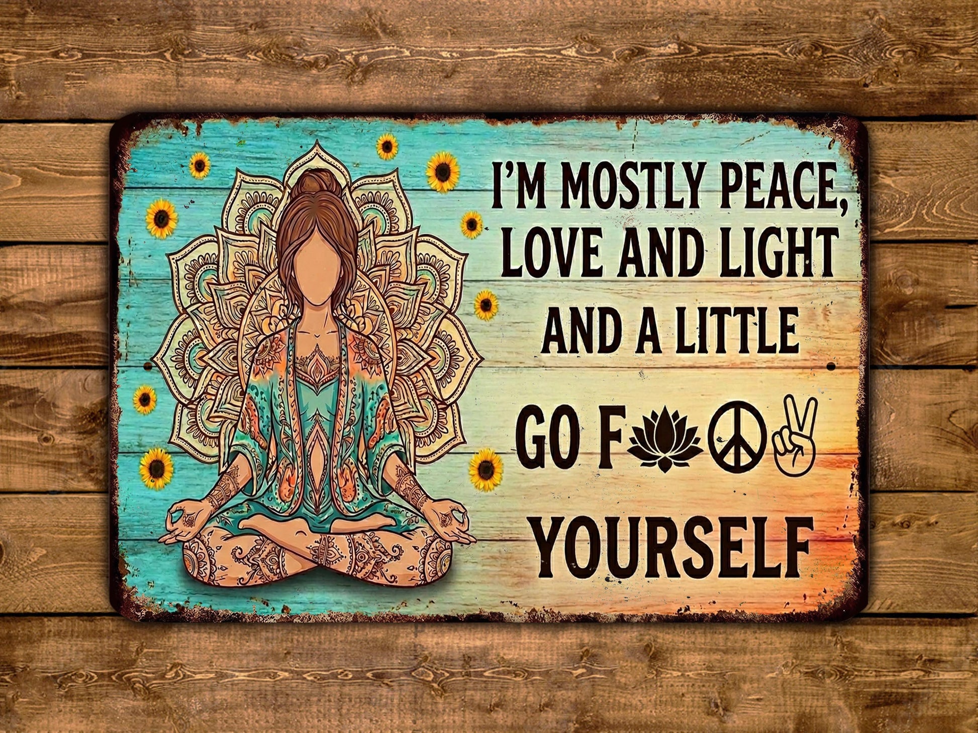 A vintage-style sign with a woman in a meditative pose surrounded by sunflowers and a peace sign, along with the text "I'm mostly peace, love and light and a little go for yourself".