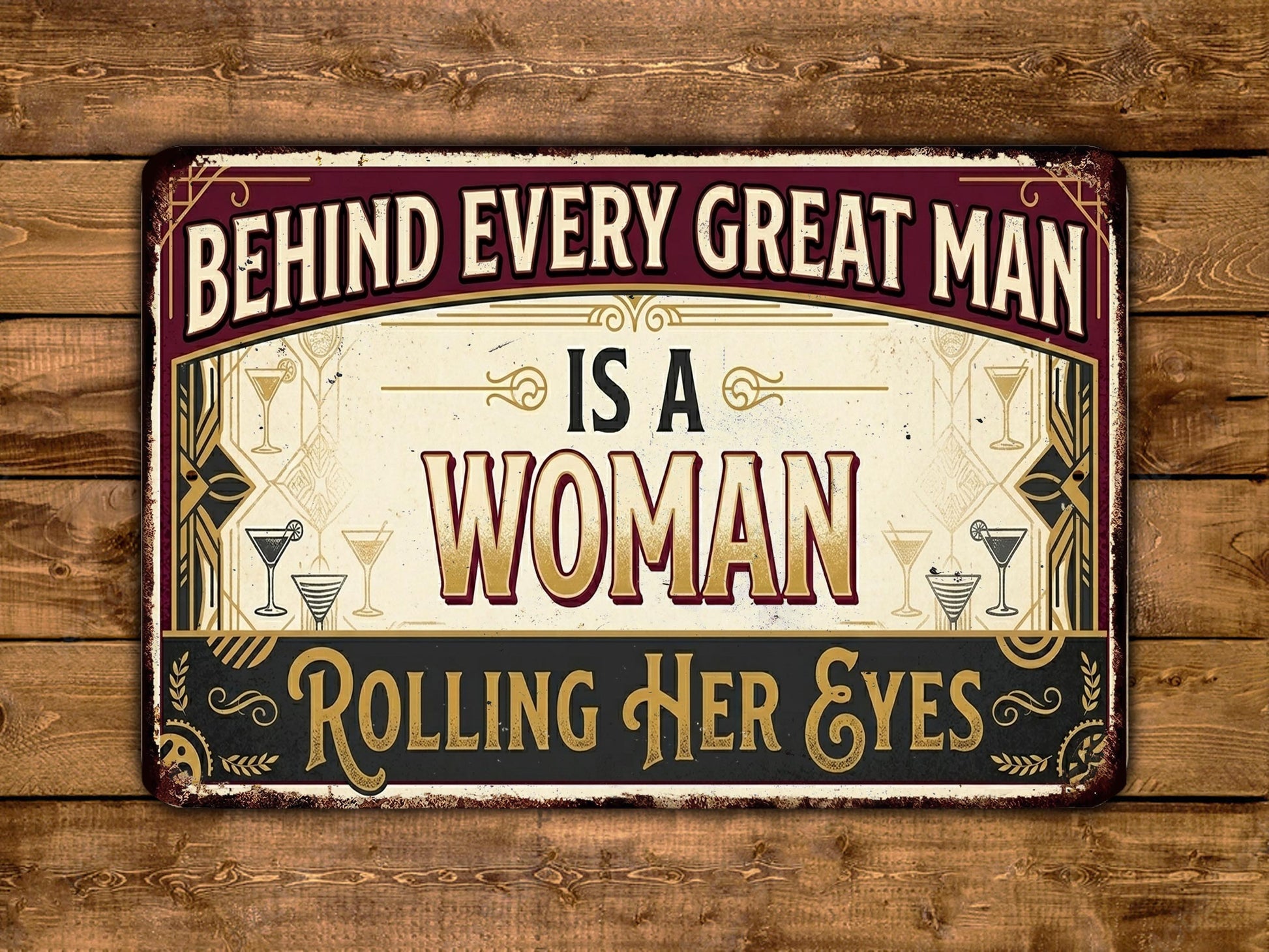 The image is a vintage-style sign with the text "Behind Every Great Man Is A Woman Rolling Her Eyes" displayed on a wooden background.