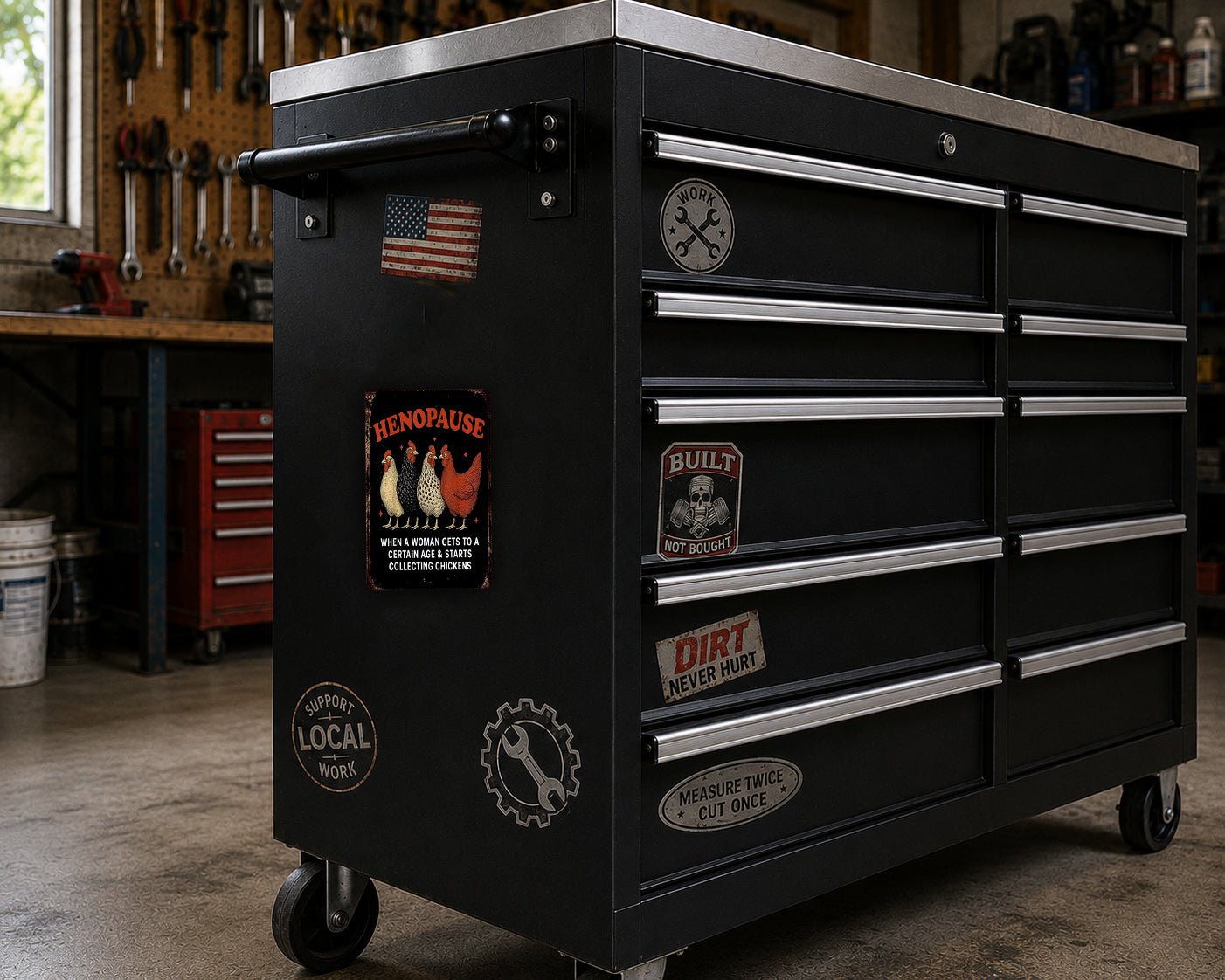 A black workbench with various stickers and magnets on it, located in a workshop setting.