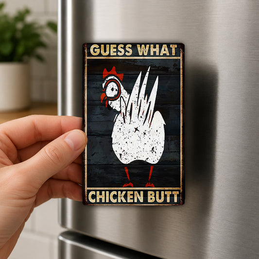 A person's hand is holding a metal refrigerator magnet with a humorous text and a cartoon image of a chicken.