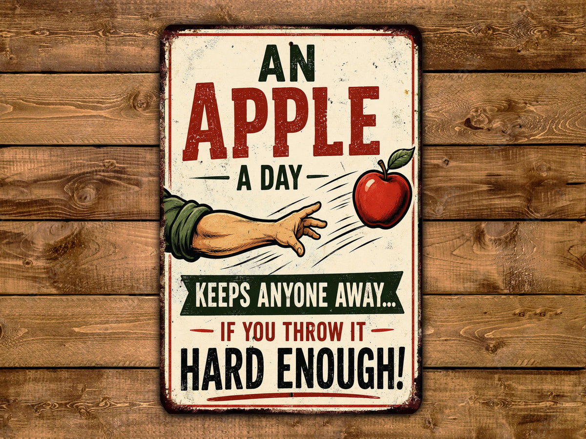 The image is a vintage-style sign with a humorous message about apples, placed on a wooden background.