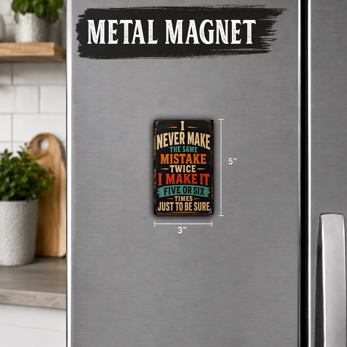 a small, colorful metal magnet with a humorous message on it, placed on a refrigerator.