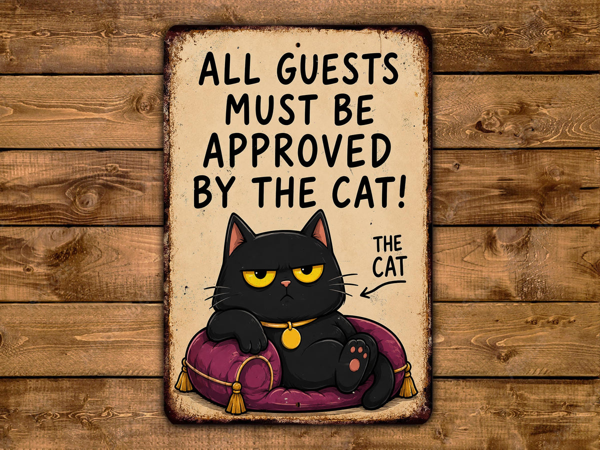 A sign with a cartoon cat sitting on a pillow and the text "ALL GUESTS MUST BE APPROVED BY THE CAT!"
