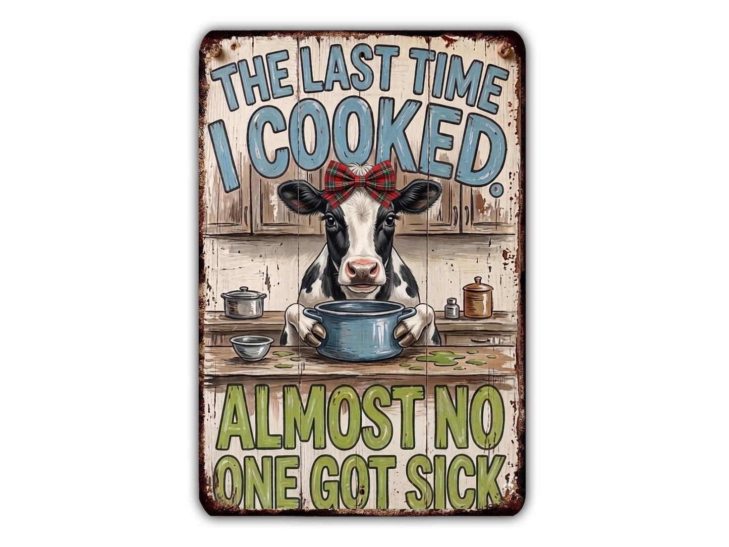 a cow sitting at a table with a pot in front of it, and the text above the cow reads "The last time I cooked almost no one got sick".