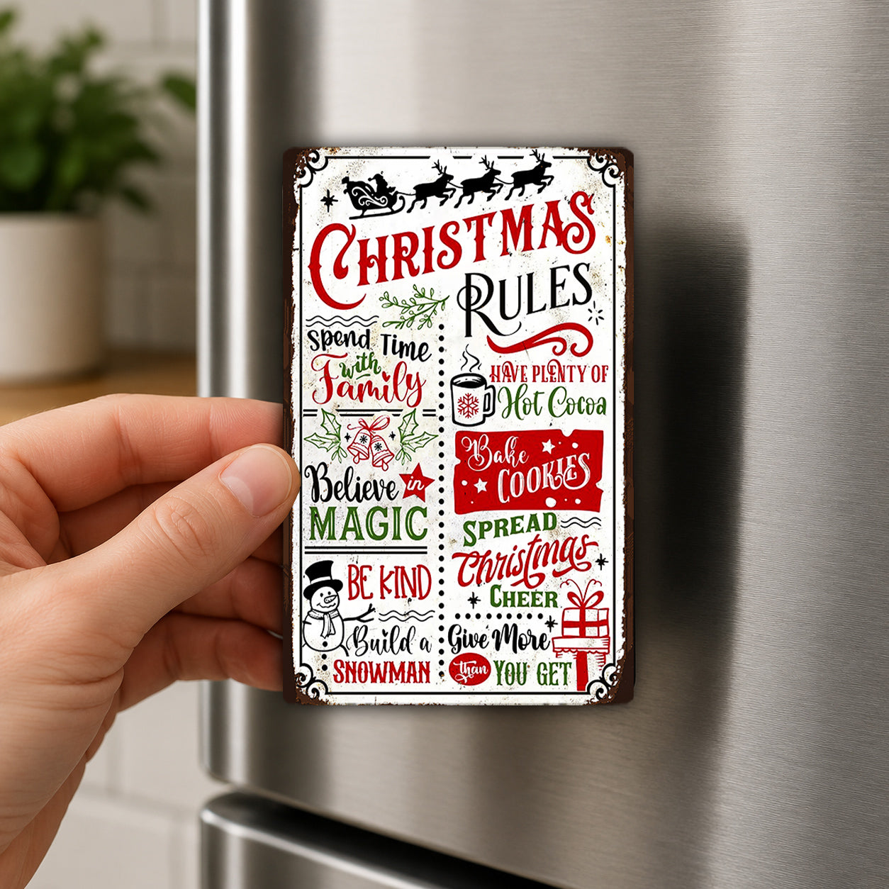 A person's hand is holding a Christmas-themed metal sign with various holiday-related rules and phrases.