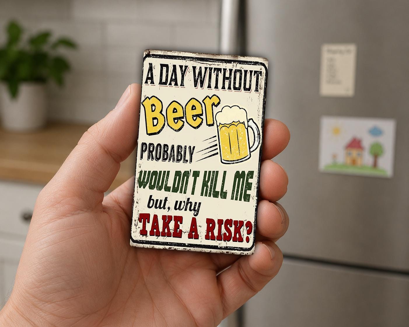 A person's hand holding a metal sign with a humorous message about beer.