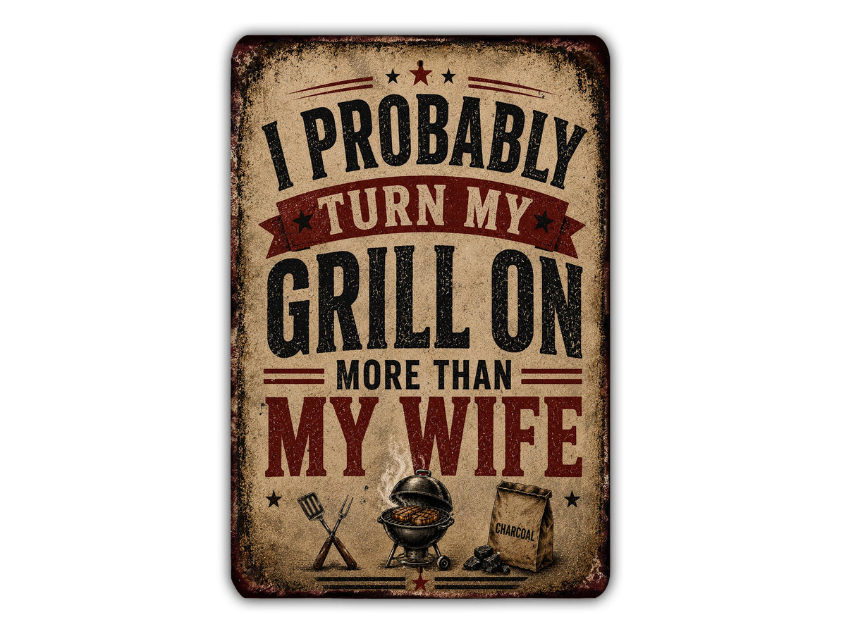 a sign with the text "I PROBABLY TURN MY GRILL ON MORE THAN MY WIFE" along with an illustration of a barbecue grill and some barbecue-related items.